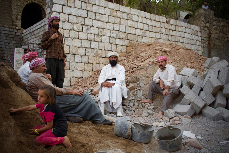 Baba Cewish presiding over new construction at the Ezidi sanctum of Lalish.